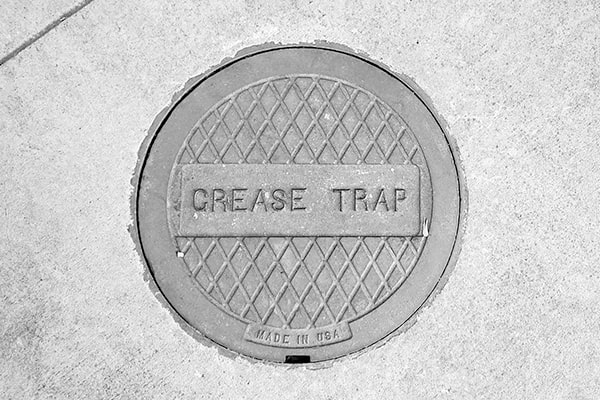 if your grease trap is filling up with solid waste and grease, it's time for grease trap pumping